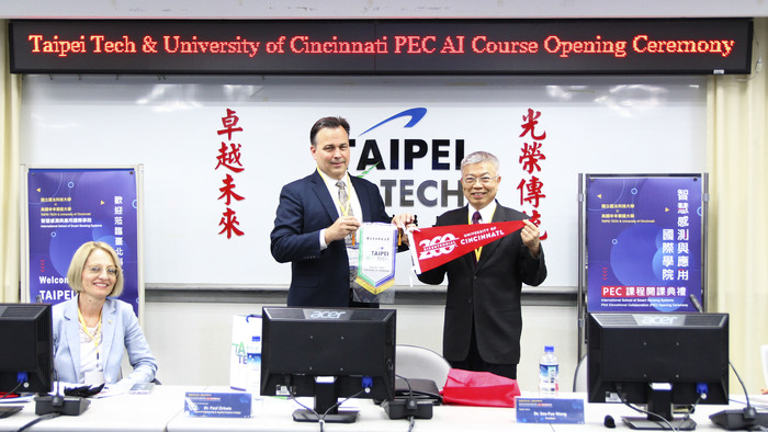 Gift exchange between Taipei Tech and UC.